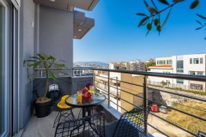 a balcony with a table with fruit on it at Amersa Luxury Apartments in Heraklio Town