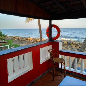 a bar with a view of the ocean at Mermaid Island Beach Resorts in Puducherry