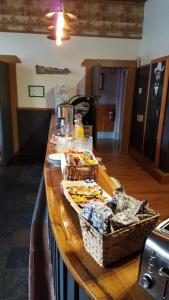 a kitchen counter with baskets of food on it at Hunters Hotel in Queenstown