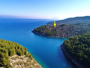 an island in the middle of a body of water at Green Area Stone House in Vela Luka +58 photos