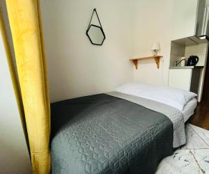 Łóżko lub łóżka w pokoju w obiekcie Narutowicza 5 Apartments