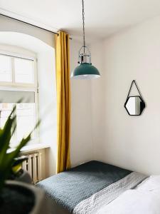 Łóżko lub łóżka w pokoju w obiekcie Narutowicza 5 Apartments
