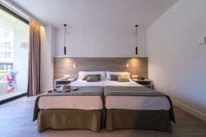 Cama o camas de una habitación en Estival Islantilla