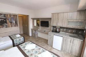 Kuchyň nebo kuchyňský kout v ubytování Street61 Apart Hotel
