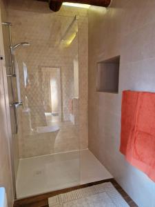 a shower with a glass door in a bathroom at Cozy 1 Bedroom House in Iz-Zejtun in Żejtun