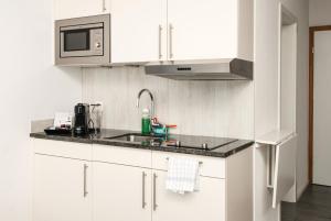 Cucina o angolo cottura di Tailormade Hotel IDEA Spreitenbach