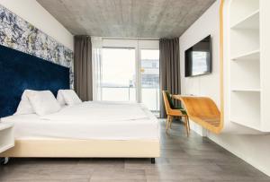 Letto o letti in una camera di Tailormade Hotel IDEA Spreitenbach