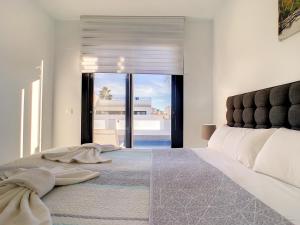 a bedroom with a large bed with a large window at Villa Sur - Sucina - 8409 in Sucina +55 photos