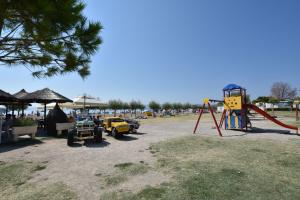 a park with a playground and a swing set at Apartment Sreta in Omiš