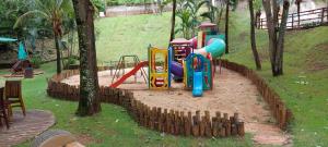 a playground with a slide in a park at Thermas Paradise in Rio Quente