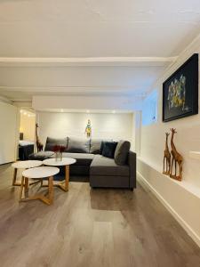 a living room with a couch and a table at aday - Modern apartment in the Heart of Aalborg in Aalborg