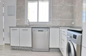 Kuchyňa alebo kuchynka v ubytovaní Chalet Lobita