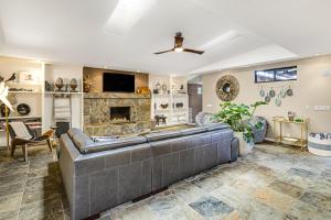 a living room with a couch and a fireplace at Movie Colony East Eden Permit# 3625 in Palm Springs