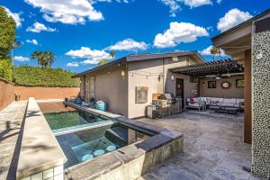 a backyard with a pool and a house at Movie Colony East Eden Permit# 3625 in Palm Springs