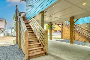 a set of wooden stairs leading to a house at Stack Overflow in Port Aransas