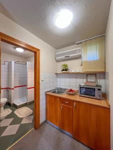 A kitchen or kitchenette at Hévíz Apartman Hévíz