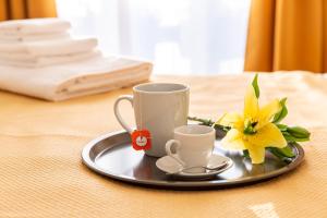 Coffee and tea making facilities at Milano City Apartments - Stylish House Free WiFi-Parking-Airport