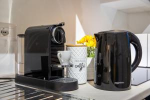 Coffee and tea making facilities at Milano City Apartments - Stylish House Free WiFi-Parking-Airport