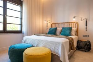 Posteľ alebo postele v izbe v ubytovaní Naillac Elite Suites