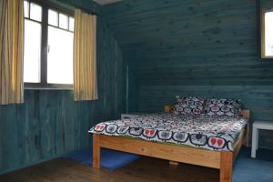 Voodi või voodid majutusasutuse Kivi-Roosi Holiday House toas