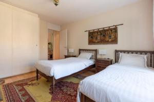 Ένα ή περισσότερα κρεβάτια σε δωμάτιο στο Lakeside-Apartment-1 Grand appartement familial avec 2 terrasses et vue panoramique