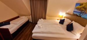 Hotel Frankfurt Messe客房内的一张或多张床位