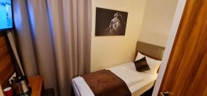 Hotel Frankfurt Messe客房内的一张或多张床位