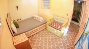 سرير أو أسرّة في غرفة في Complexe rueda