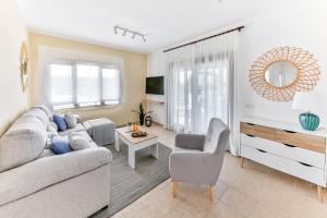 a living room with a couch and a table at Sea Palms Lanzarote in Playa Blanca