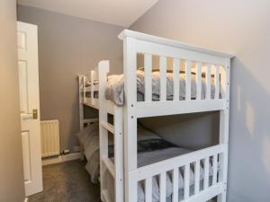 a white bunk bed in a room at 7 Railway Cottages in Ulverston