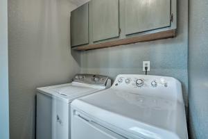 a white washer and dryer in a small room at Divide Cabin in the Heart of Colorful Colorado! in Midland