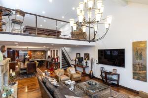 a living room with a couch and a chandelier at 601 Deer Valley Drive in Park City