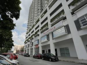 a large white building with cars parked in a parking lot at Homestay TTDI ADINA 710 Shah Alam,Sek 13,MSU,3Bedroooms in Shah Alam