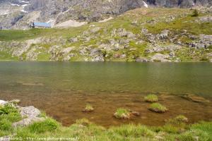 a lake on the side of a mountain at Le Perce Neige in Vaujany