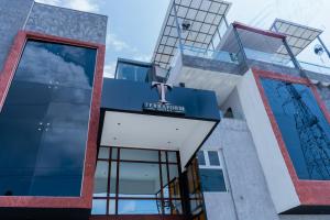 a building with a sign on the front of it at Terraform Hotel in Lagos