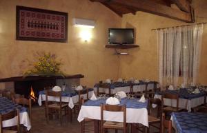TV a/nebo společenská místnost v ubytování Agriturismo Il Paradiso