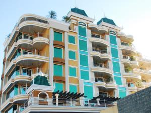 a tall building with balconies on the side of it at Fields Plaza Hotel by ABC in Angeles