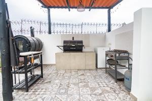 a kitchen with a table and a stove in a room at The first real Bed & Breakfast Hiking Hotel 'The Office' in Arequipa, Peru in Arequipa