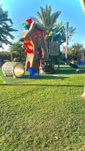 a playground with a slide in a park at יולי גולף in Caesarea