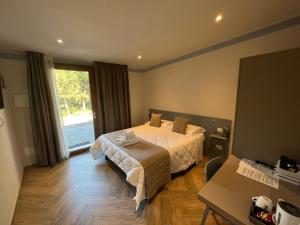 Postel nebo postele na pokoji v ubytování Agriturismo Rascioni & Cecconello