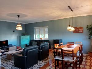 a living room with a couch and a table at casal do melro in Ericeira