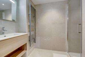a bathroom with a shower and a sink at Echo du Pleney A204 in Morzine
