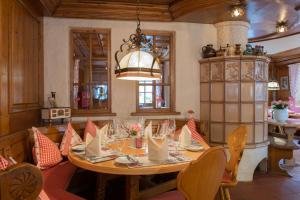 a dining room with a table and chairs at Gasthaus Auerhahn in Baden-Baden