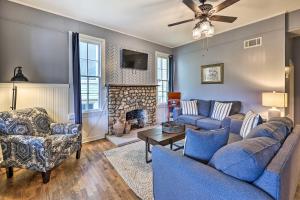 a living room with two couches and a fireplace at Cozy Eureka Springs Cottage, Walk to Dtwn! in Eureka Springs