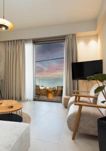 a living room with a view of the ocean at KALES SEA VIEW SUITES in Ierapetra