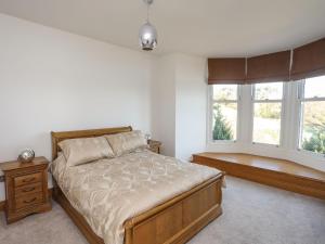 Bryn Mel Manor Straits View tesisinde bir odada yatak veya yataklar