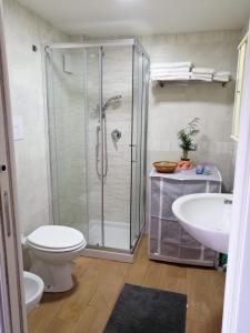 a bathroom with a shower and a toilet and a sink at B&B Perla Cavese in Cava deʼ Tirreni +16 photos