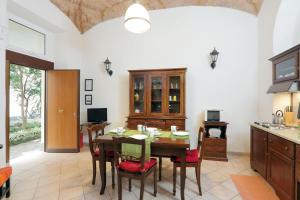 a kitchen with a table and chairs in a room at Lucky Holidays in Rome
