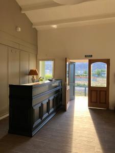 a large kitchen with a large island in the middle at HOSPEDAR CALAFATE - Los Lupinos in El Calafate