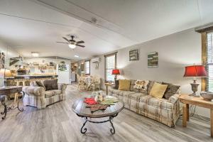 a living room with two couches and a table at Bring a Pet Smoky Mtn Vacation Rental with Yard! in Whittier